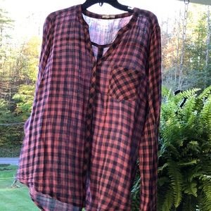 Pink and blue plaid shirt buttons down the back